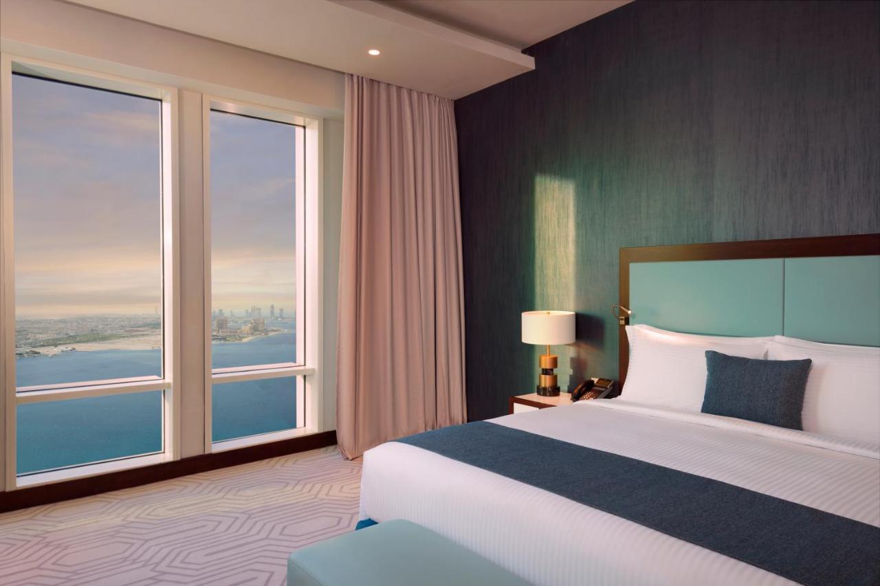 Wyndham Grand Doha West Bay Beach Luaran gambar A bedroom at the Address Downtown Dubai